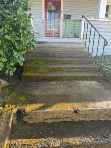 Deck, patio, and fence covered in dirt and grime before pressure washing in Salem, Oregon.